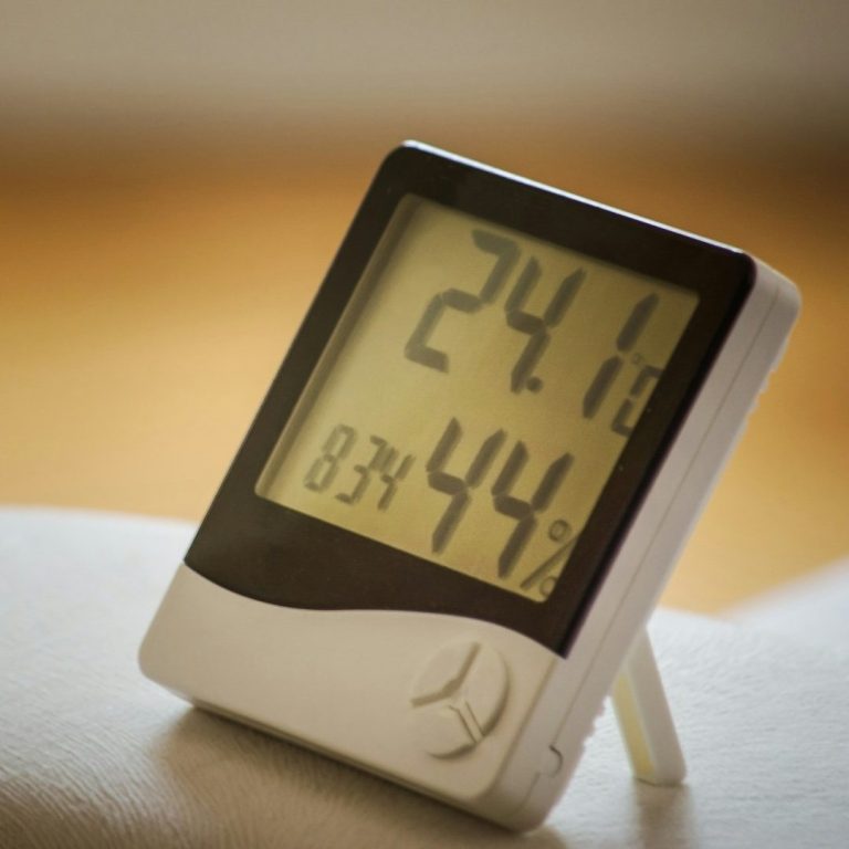 Digital thermometer displaying a temperature of 24.1°C and humidity at 44%.