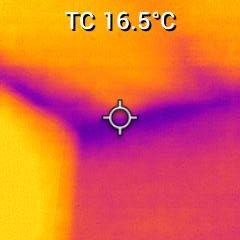 Dirt and discoloured wall with visible patches near the ground.